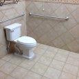 ADA Compliant Toilet with Satin Finished Grab Bars for Safety