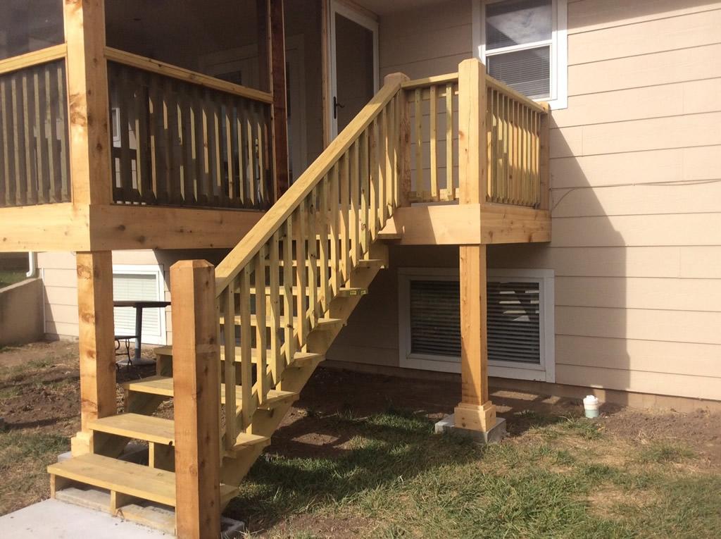 Sturdy wooden stairs with oversized landing